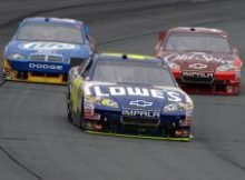 Four-time NASCAR Sprint Cup champion Jimmie Johnson pulls away from two-time champion Tony Stewart in the No. 14 and 2004 champ Kurt Busch in the No. 2 at New Hampshire Motor Speedway in Loudon, N.H. on Sunday. Credit: Drew Hallowell/Getty Images for NASCAR